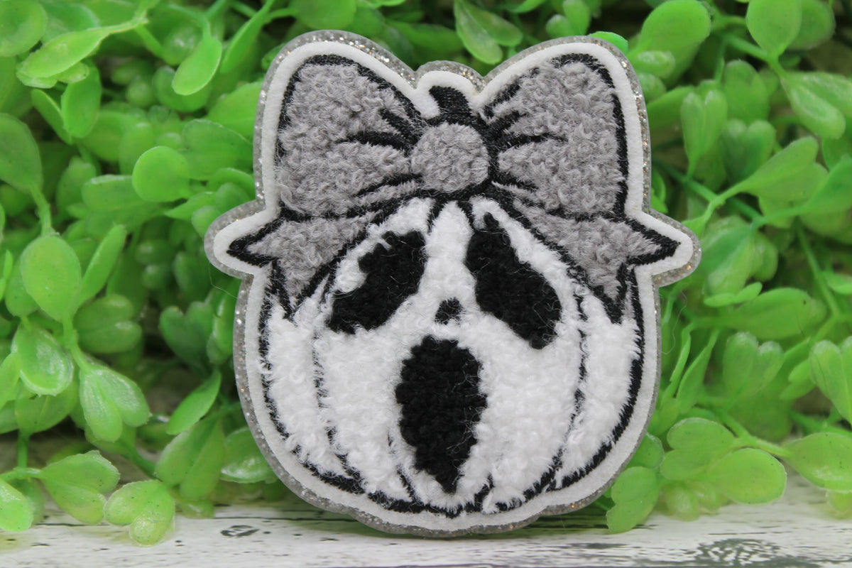 Scream Pumpkin with Bow Badge Reel