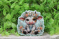 Floral Crown Cow on Light Blue Badge Reel