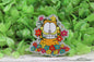 Orange Cat in Flowers Badge Reel