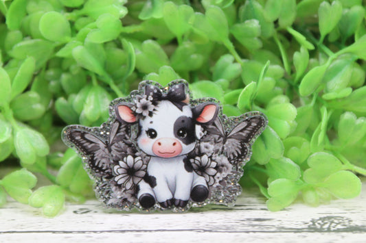 Black and White Cow with Flowers and Butterflies Badge Reel