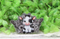Black and White Cow with Flowers and Butterflies Badge Reel