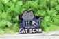 Cat Scan Gray Badge Reel