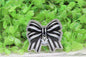 Striped Bow with Ghost Badge Reel